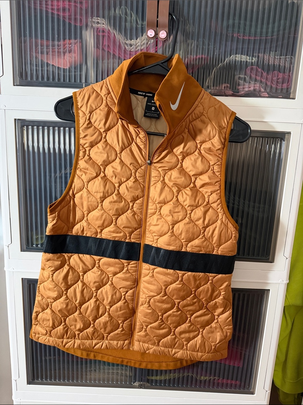 Nike Quilted Sleeveless Vest in Orange with Black Stripe